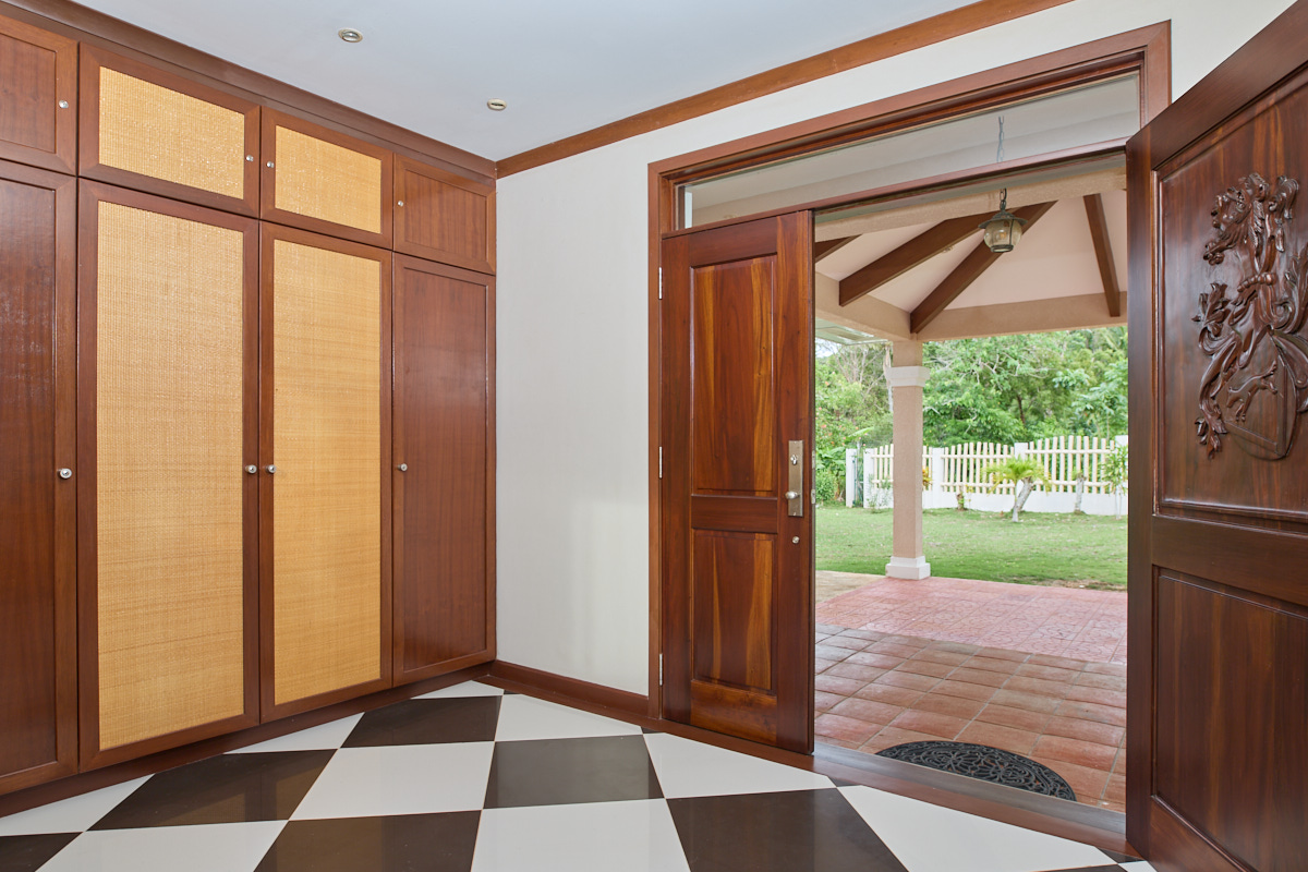 Built-in cabinets and open entrance door