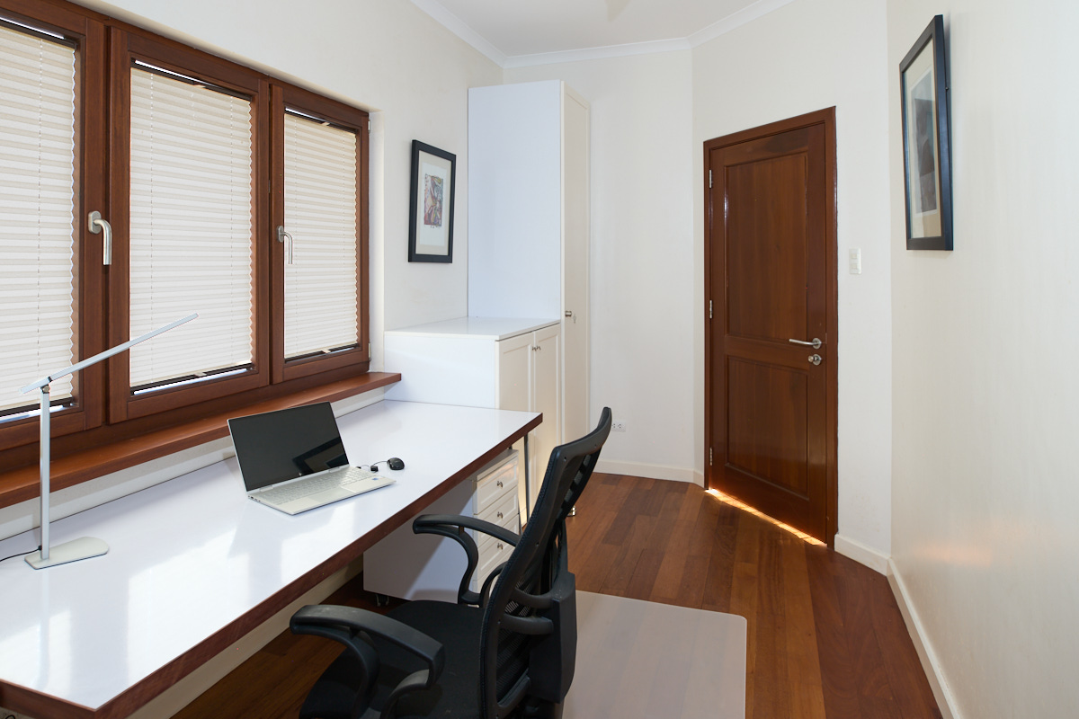 Office with large desk and cabinets